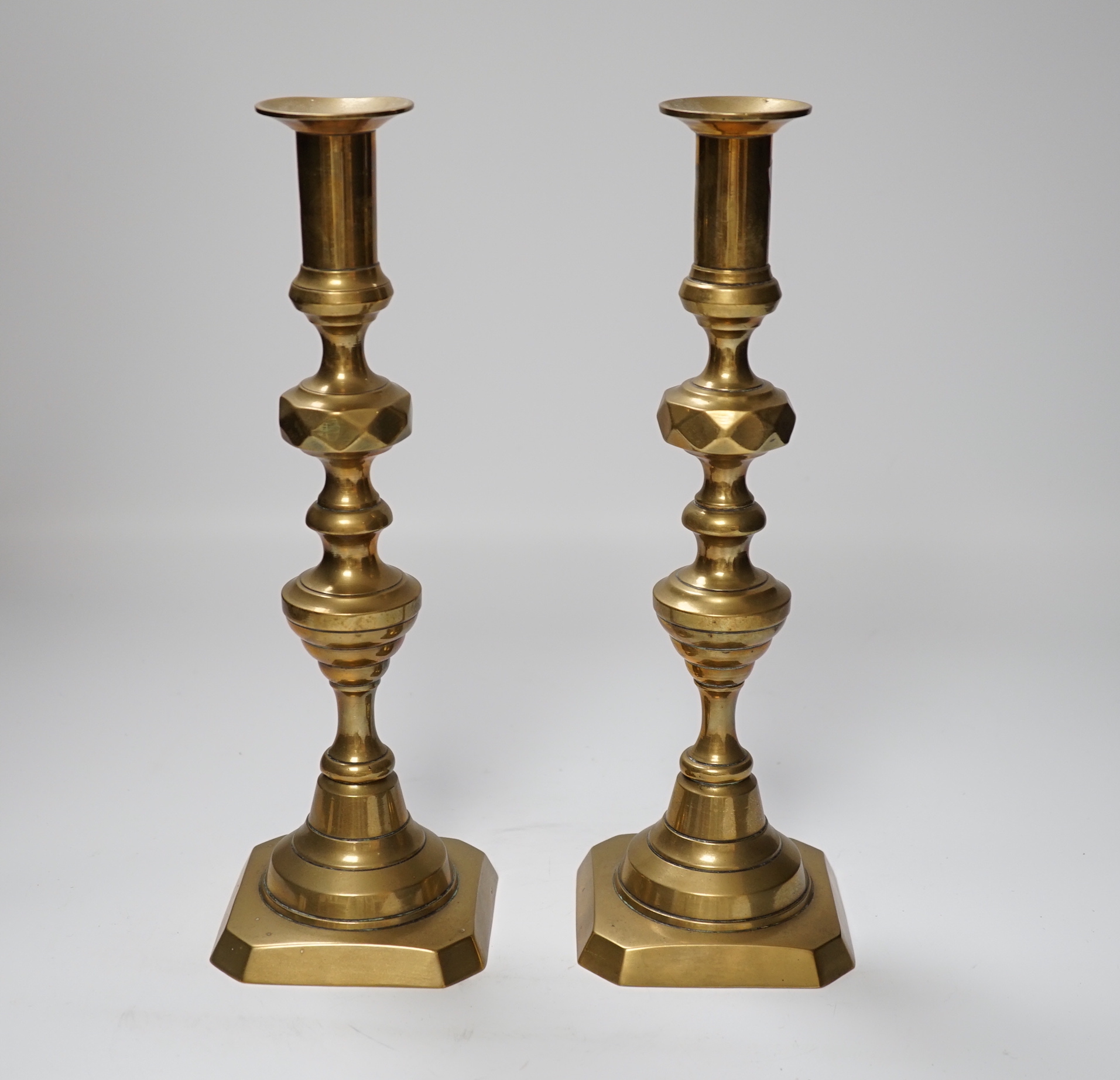 A pair of 19th century brass candlesticks, 30cm